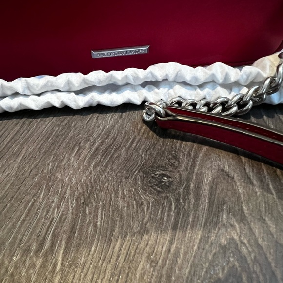 Selling a brand new Rebeca Minkoff crossbody bag in red. - Picture 7 of 7